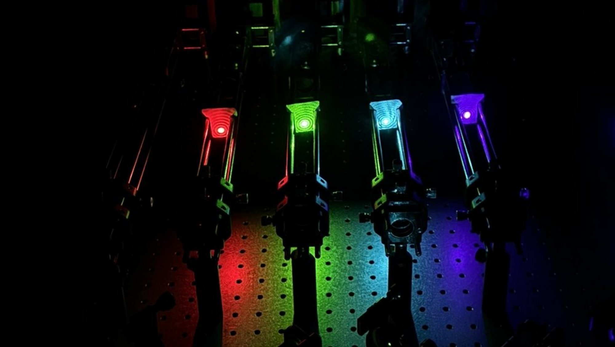 The five laser lines shown from left to right: IR (785 nm), red (637 nm), green (532 nm), blue (488 nm), UV (405 nm)